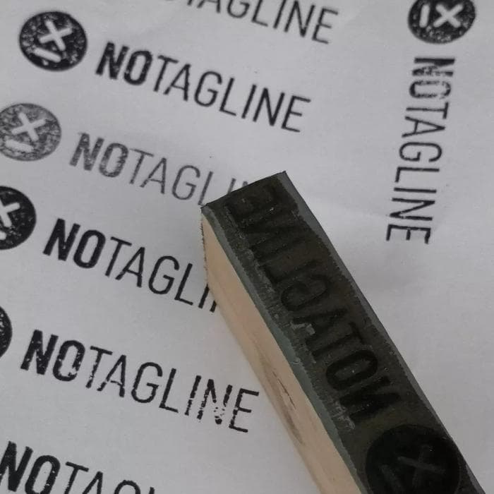 Stamped NoTagline logos on paper